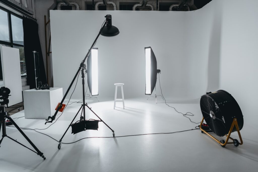 photo studio with lighting equipment and fan